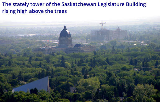 The stately tower of the Saskatchewan Legislature Building rising high above the trees